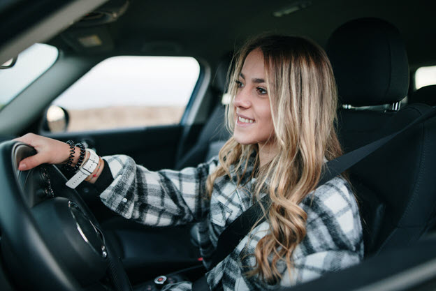 Female driver in car